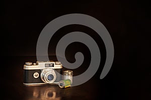 Old 50Ã¢â¬â¢s Camera and Film on Brown With Copy Space
